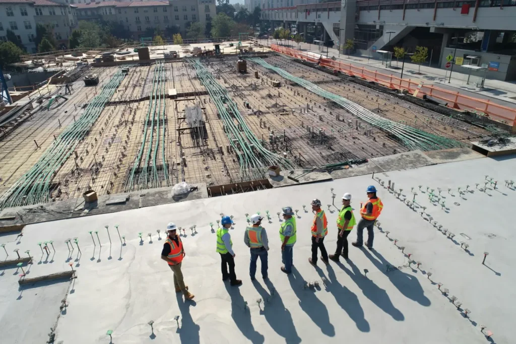 Site team walking a finished concrete slab